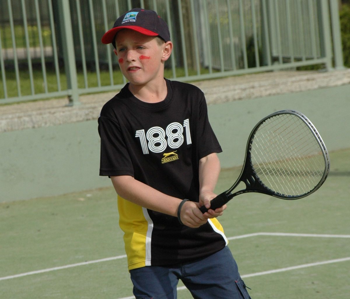 Brumbies rugby player Corey Toole as a kid playing tennis. 