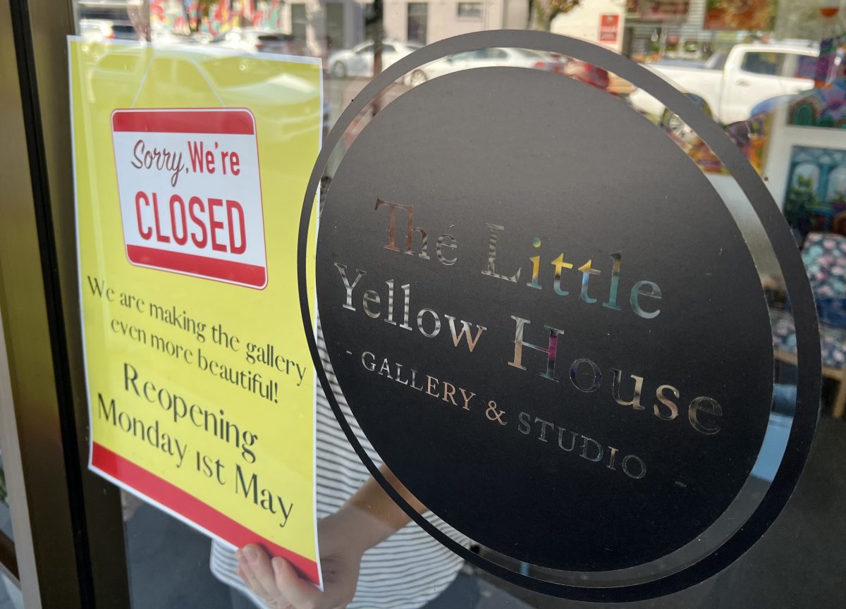 closed sign next to gallery logo