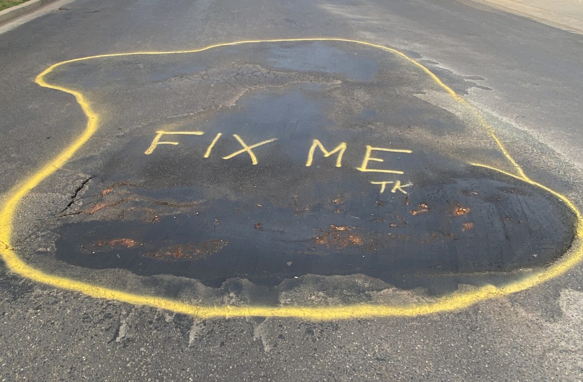 spray-painted pothole 