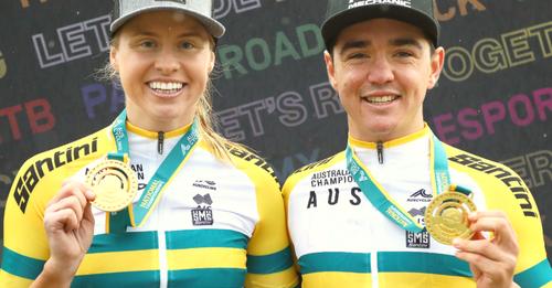 female and male mountain bike racers with medals