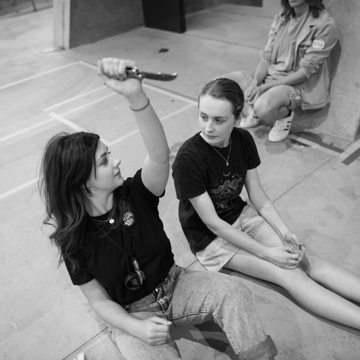 two young women on the floor acting