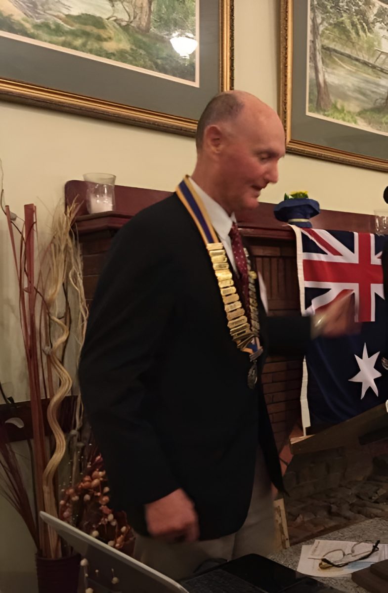 Alan Chesworth with medals around him 