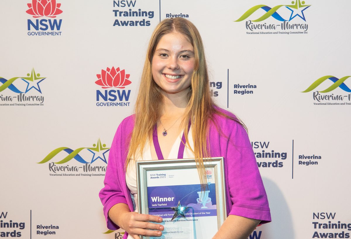 young woman with award