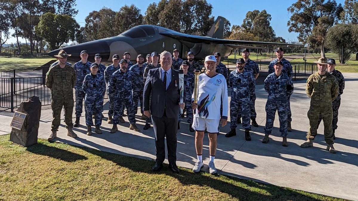 Legacy Australia CEO Graham Boyd and Wagga Legacy president Doug Conkey welcomed the Legacy Centenary Torch to the Wagga RAAF base