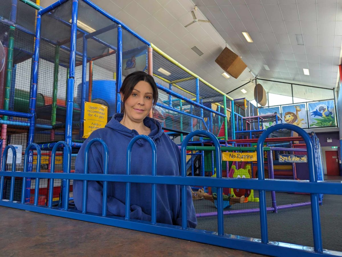 woman standing in kids' play area