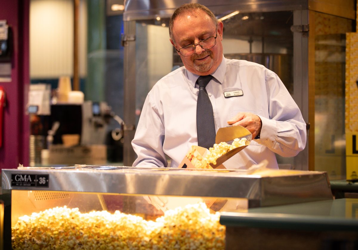 Man serving popcorn
