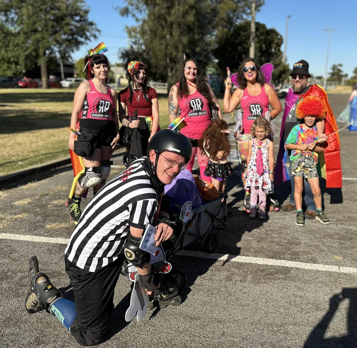 roller derby skaters and umpire