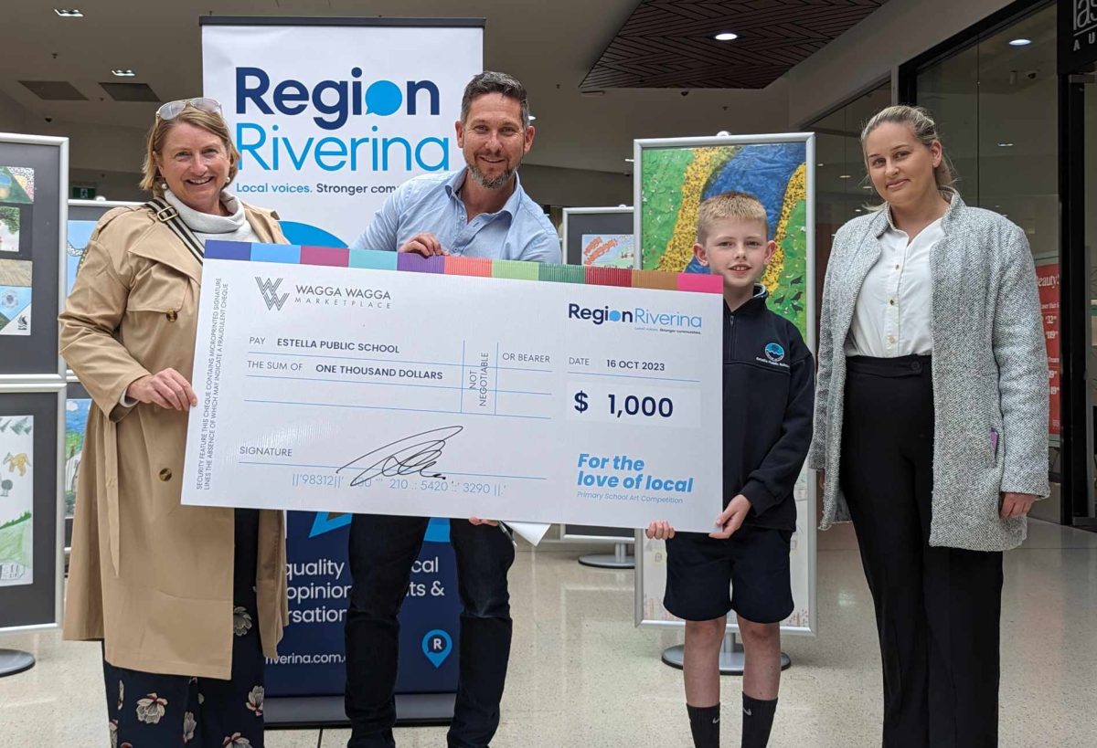 four people at cheque presentation