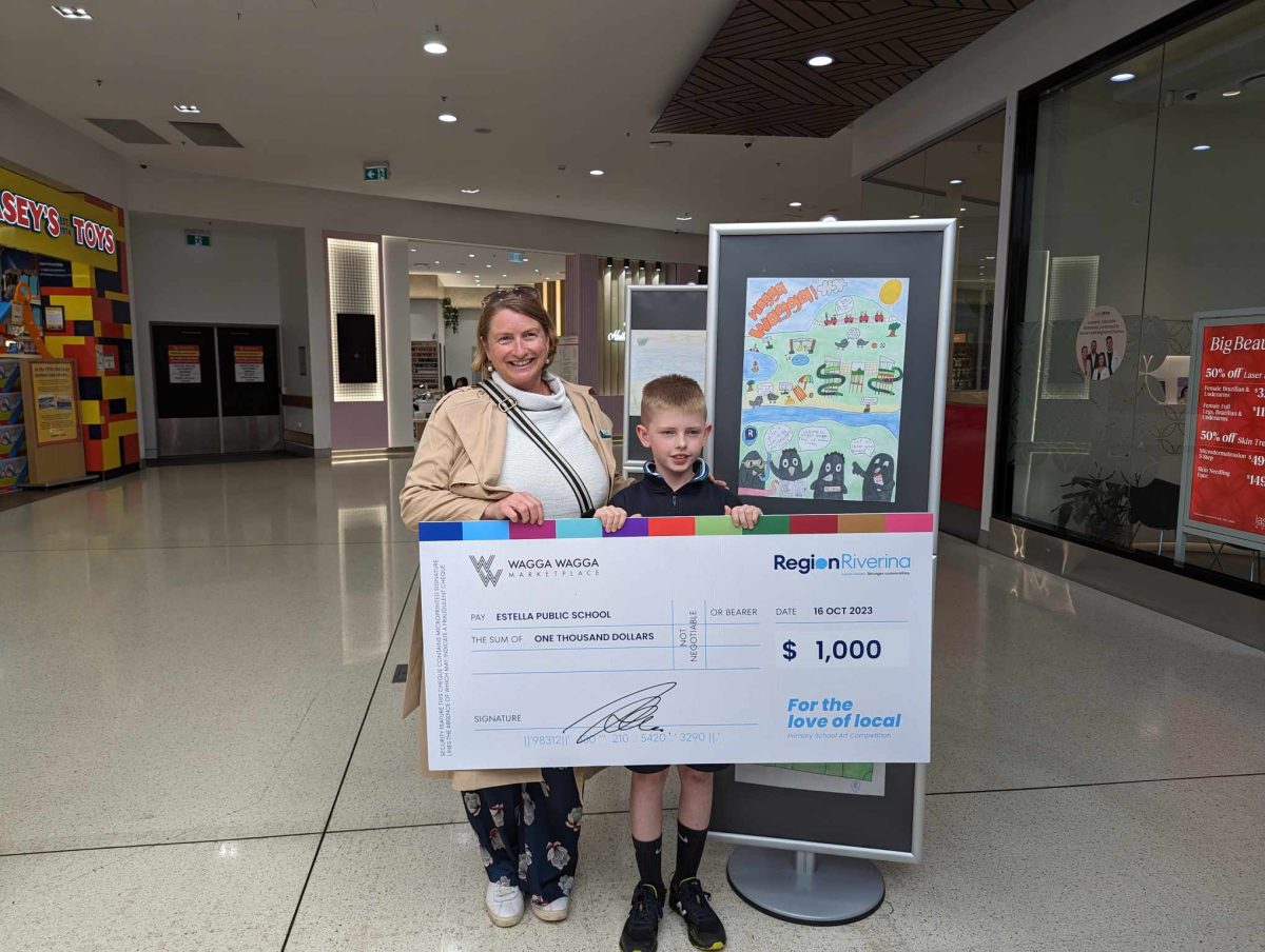 mum and son at cheque presentation