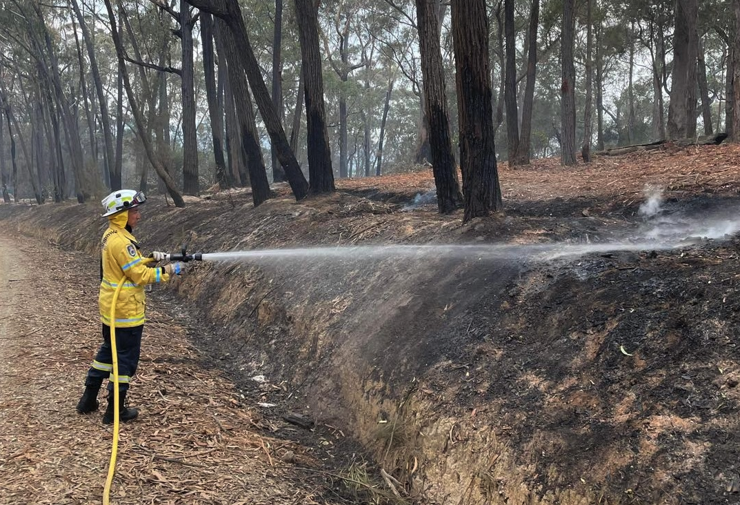 Firefighting crews are putting out hot spots and strengthening containment lines on the Coolagolite bushfire.