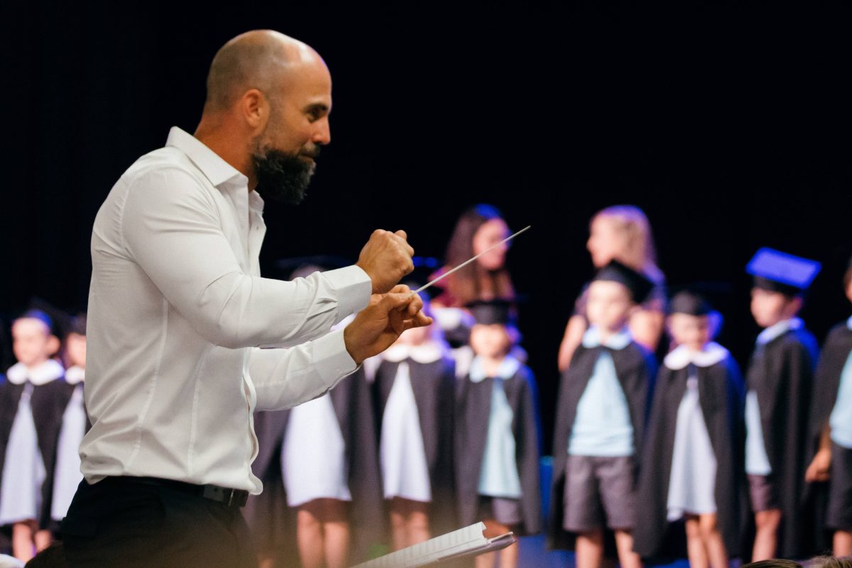 man conducting choir