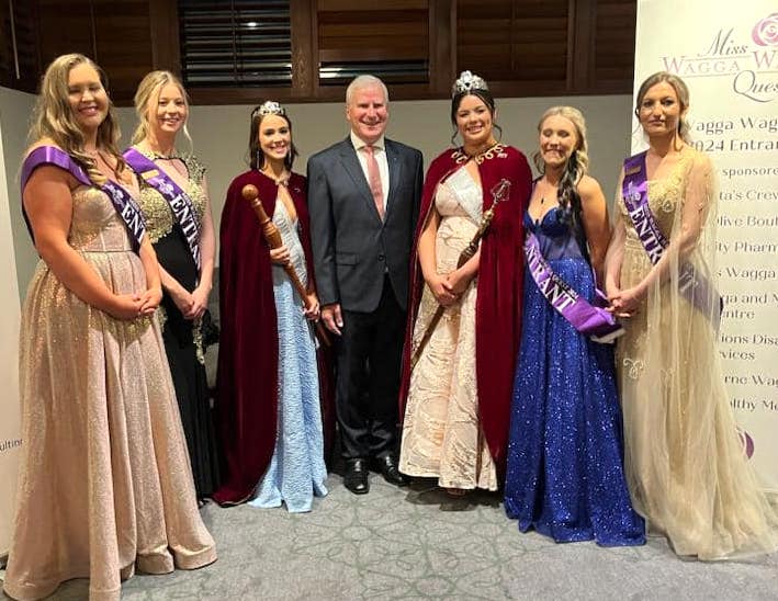 man with pageant participants