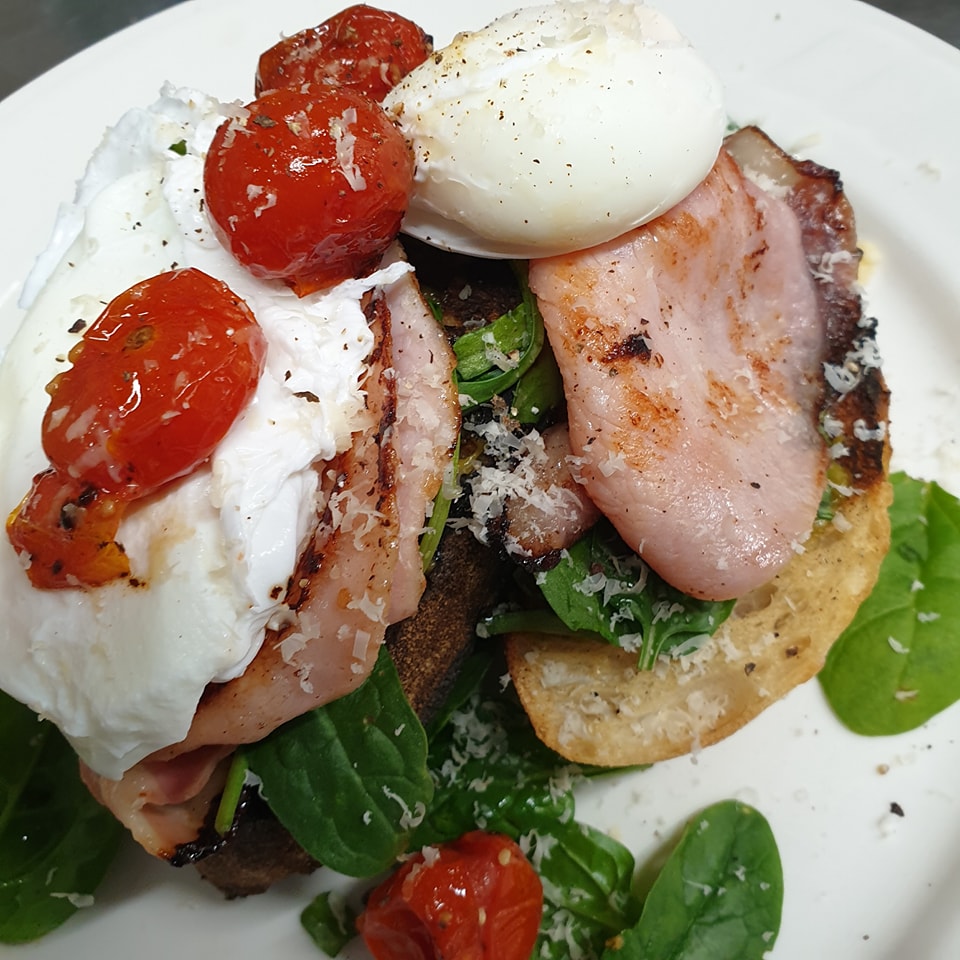 Eggs Roma: delicious crispy bacon, poached eggs and fresh cherry tomatoes with parmesan and ricotta