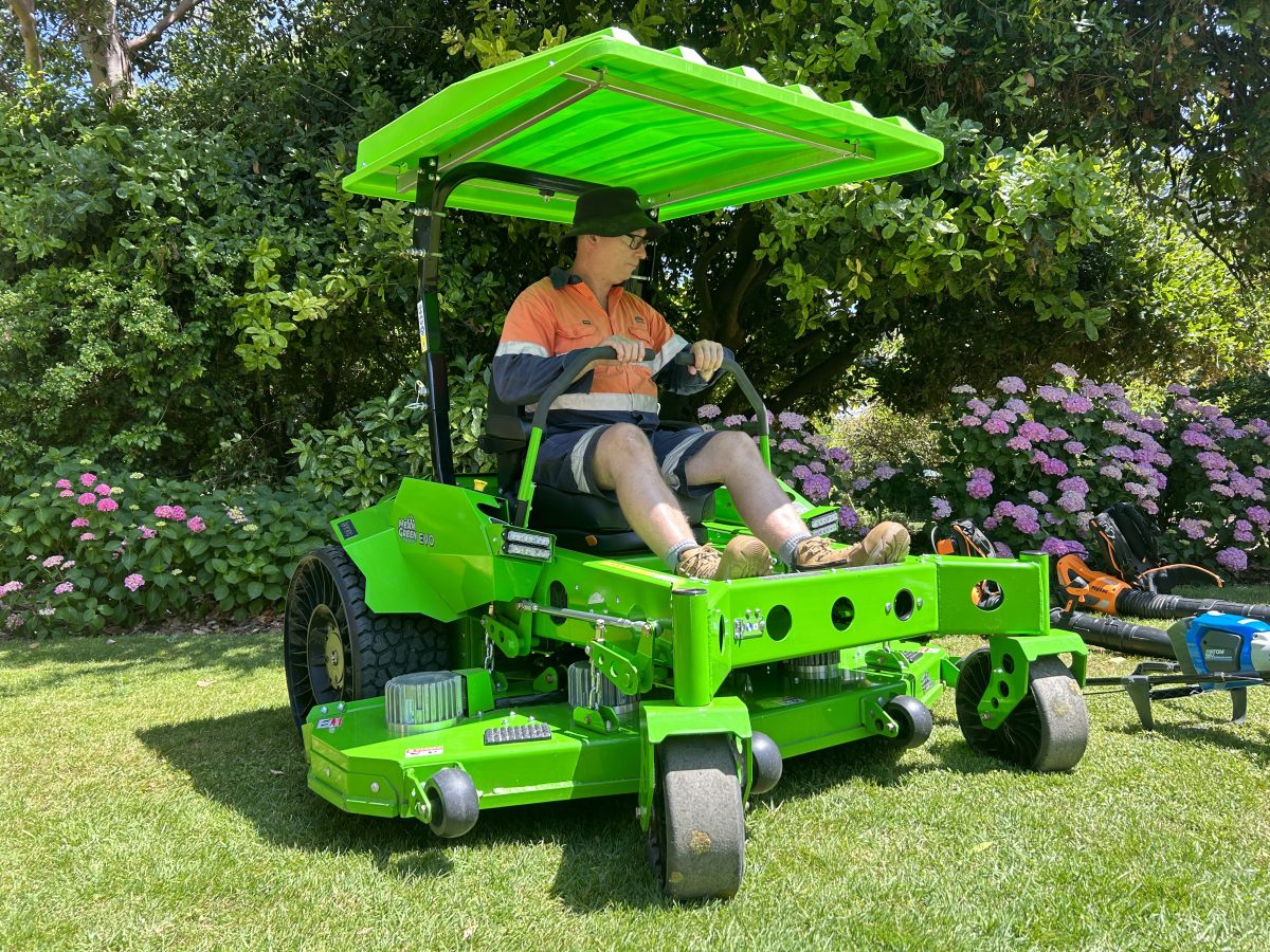 Man on electric ride on mower