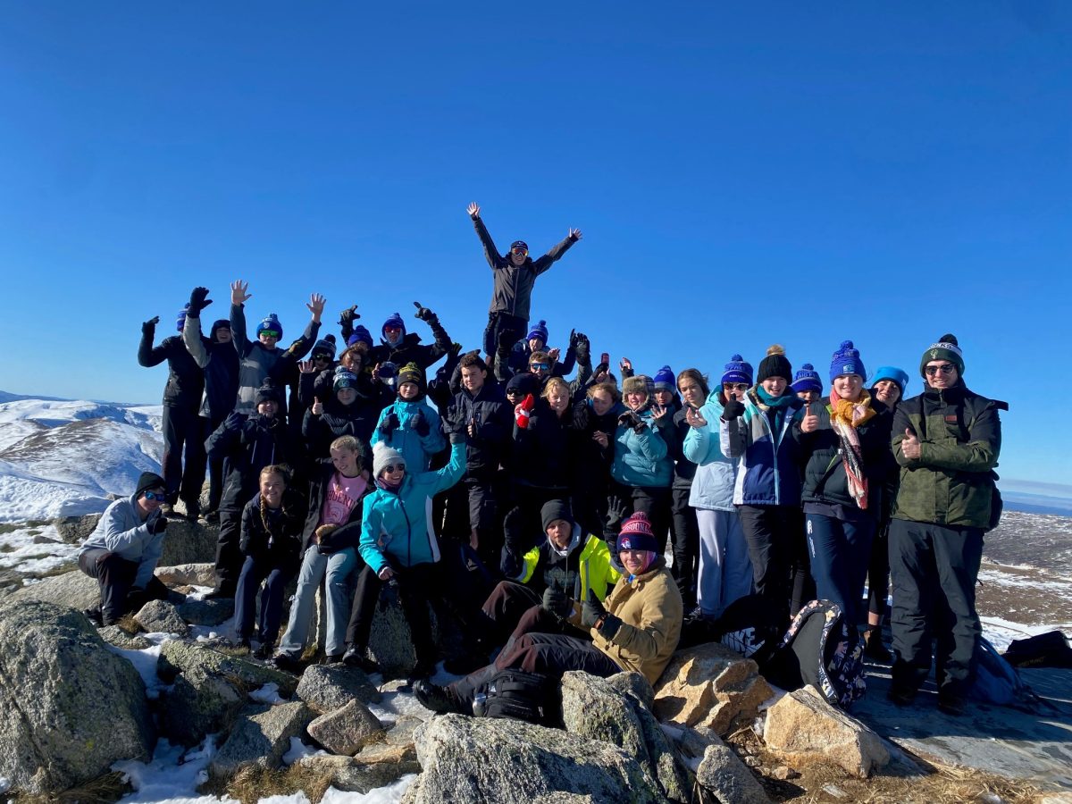 Group of students on top of mountain