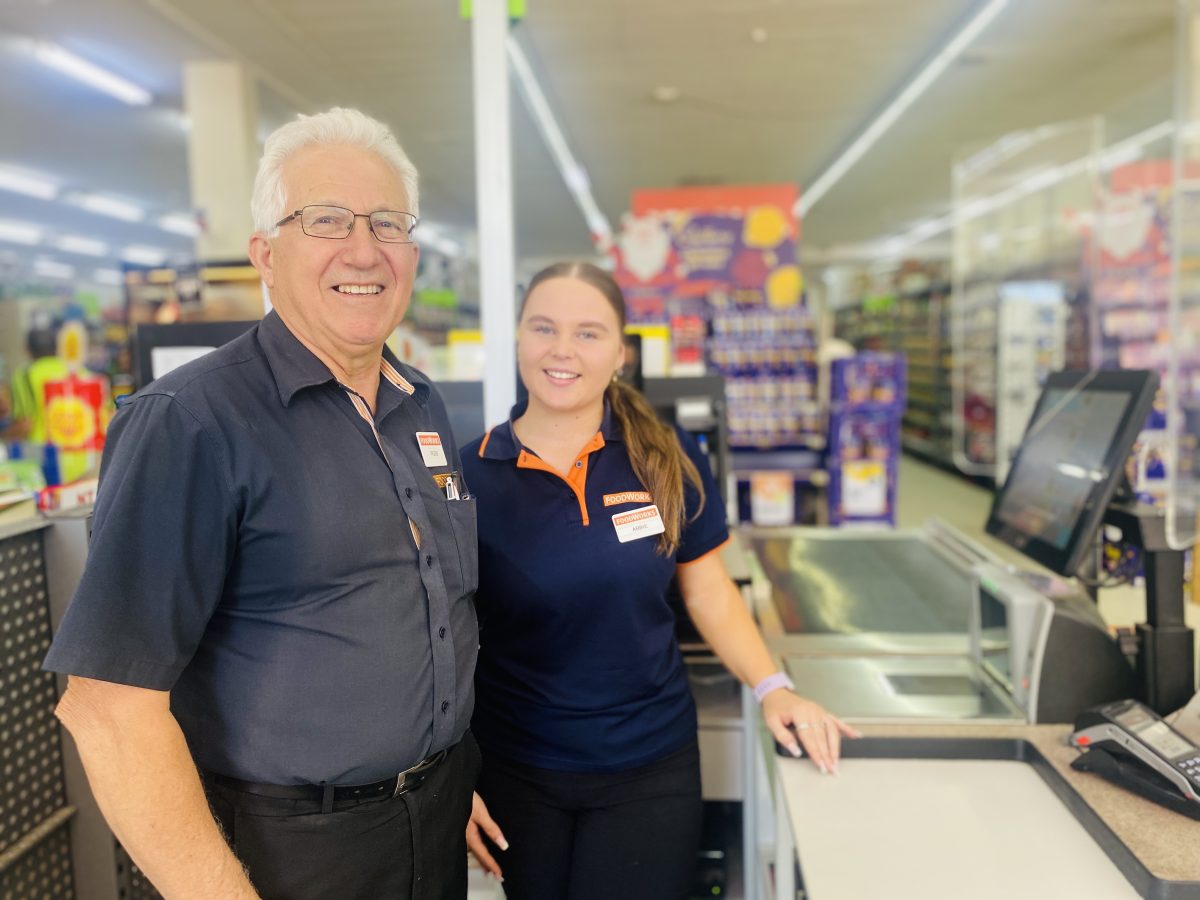 a supermarket manager and checkout assistant