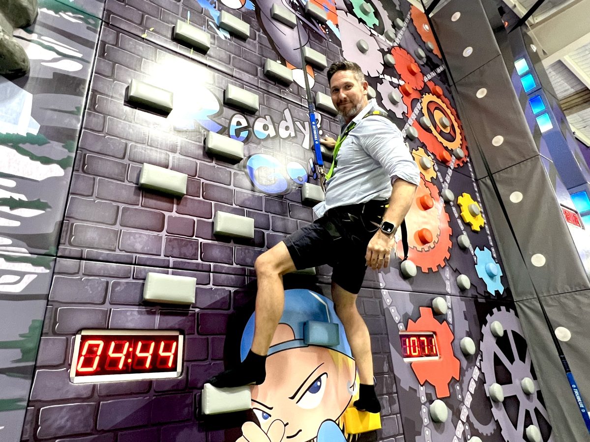 Co-owner Adam Drummond takes on the climbing walls at Vortex Entertainment. 