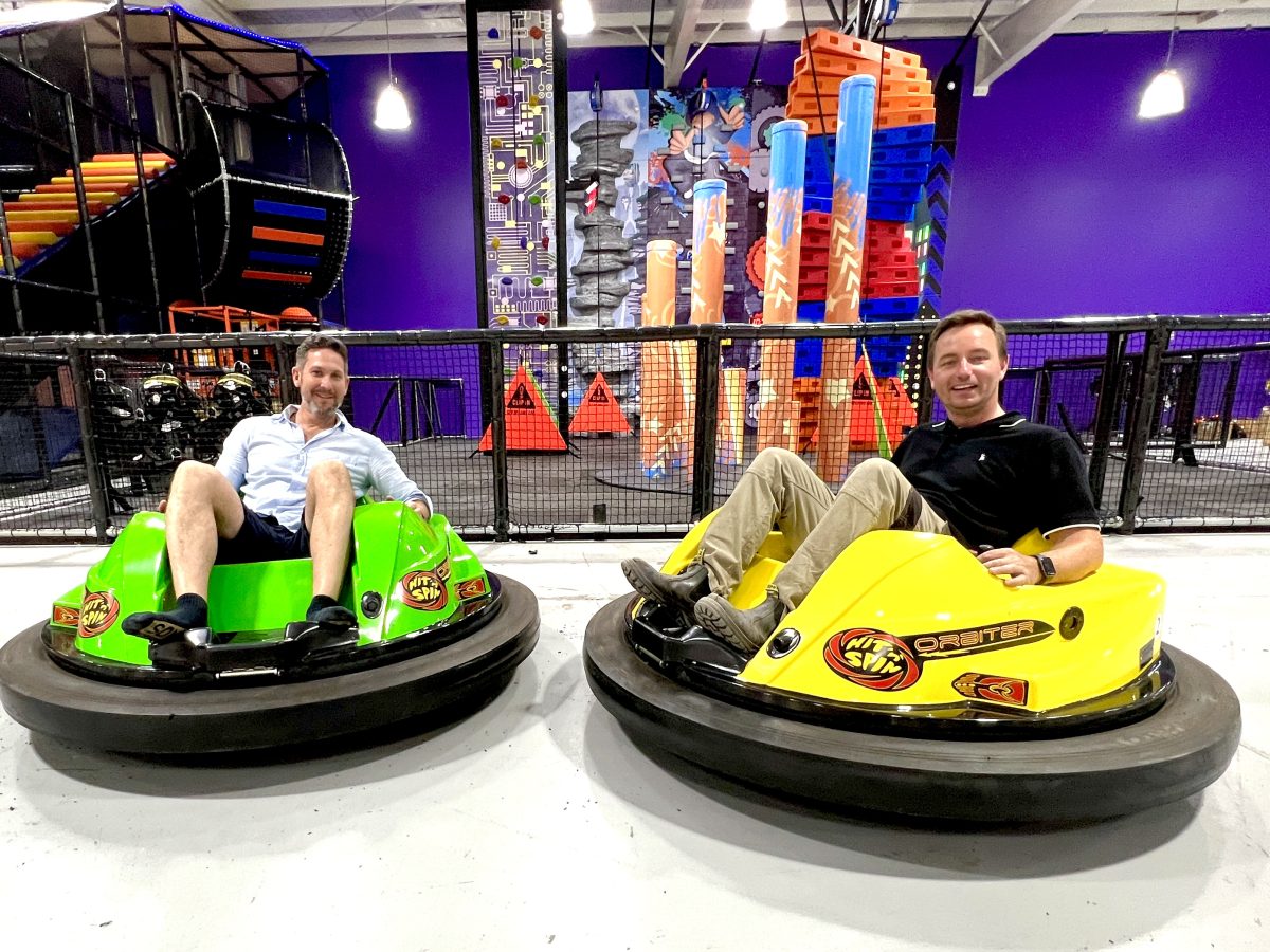 Two men on bumper cars