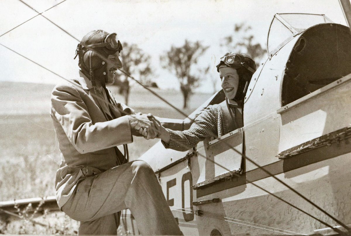 man and pilot shaking hands