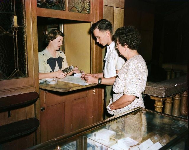 people buying cinema tickets in the 1950s