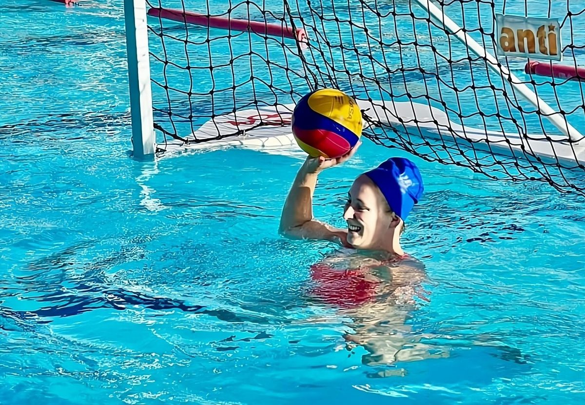 Water polo goalie with ball 