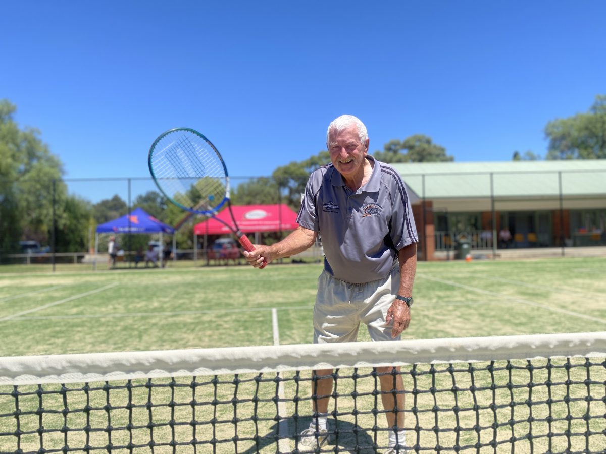 elderly man on tennis court 