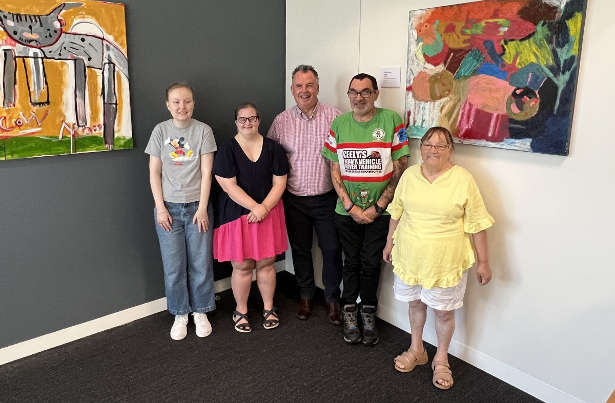 Raine Mitter, Lilly Salmon, Cr Dallas Tout, Paul Williams and Lorraine O'Hara pose with some of the spectacular works in the Wagga Mayor's office. 