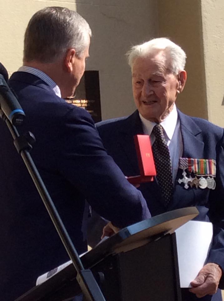 war veteran being presented with service award