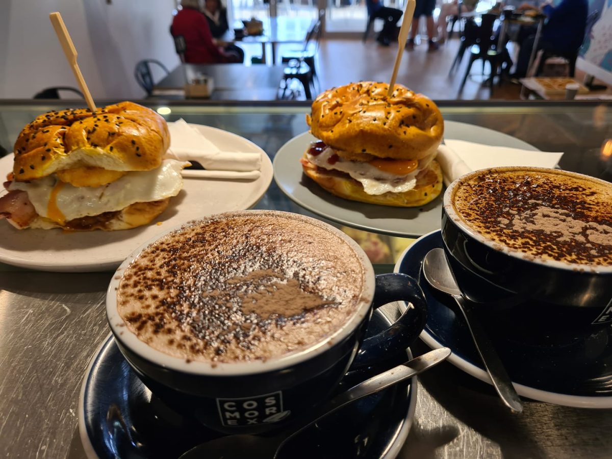 Bacon and egg rolls with hash brown and delicious coffee. 