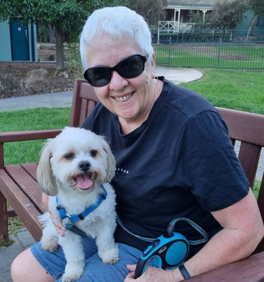 woman sitting with a dog