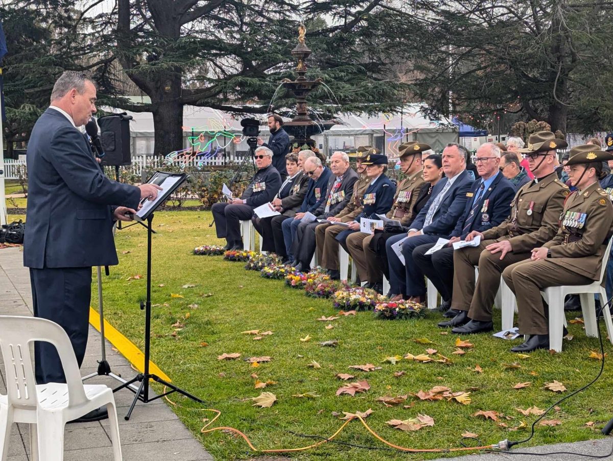 Wagga RSL sub-Branch vice-president David Abbott leads Wagga's first-ever MEAO Commemorative Service on Thursday in front of a healthy crowd at the Victory Memorial Gardens. 