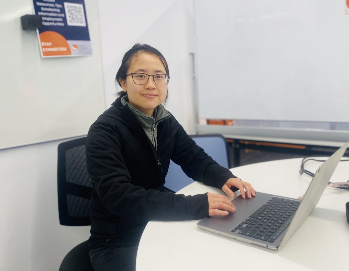 Jessica Hu in front of computer 