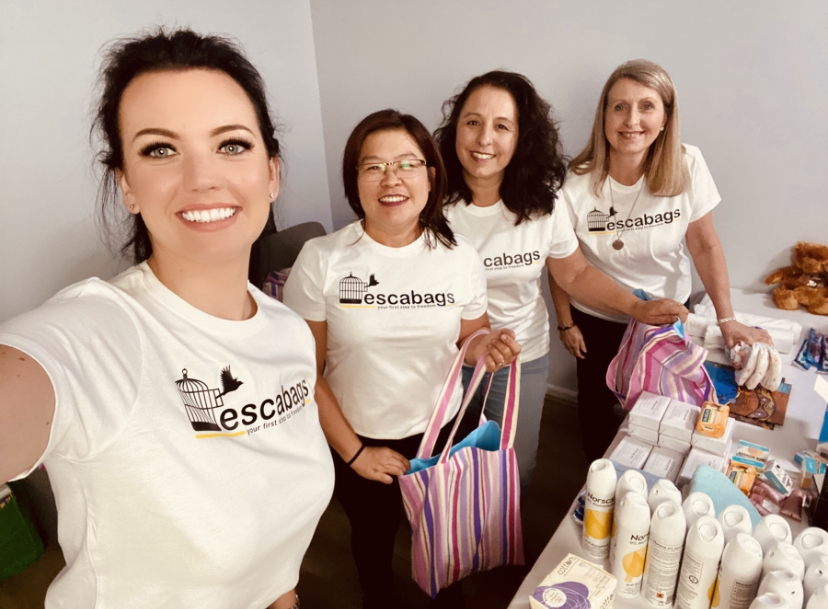 four women putting together hampers