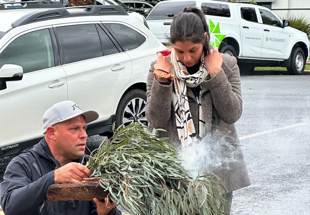 Luke Wighton welcomes Wiradjuri dancer Ella Havelka back to Wagga Wagga with a smoking ceremony.