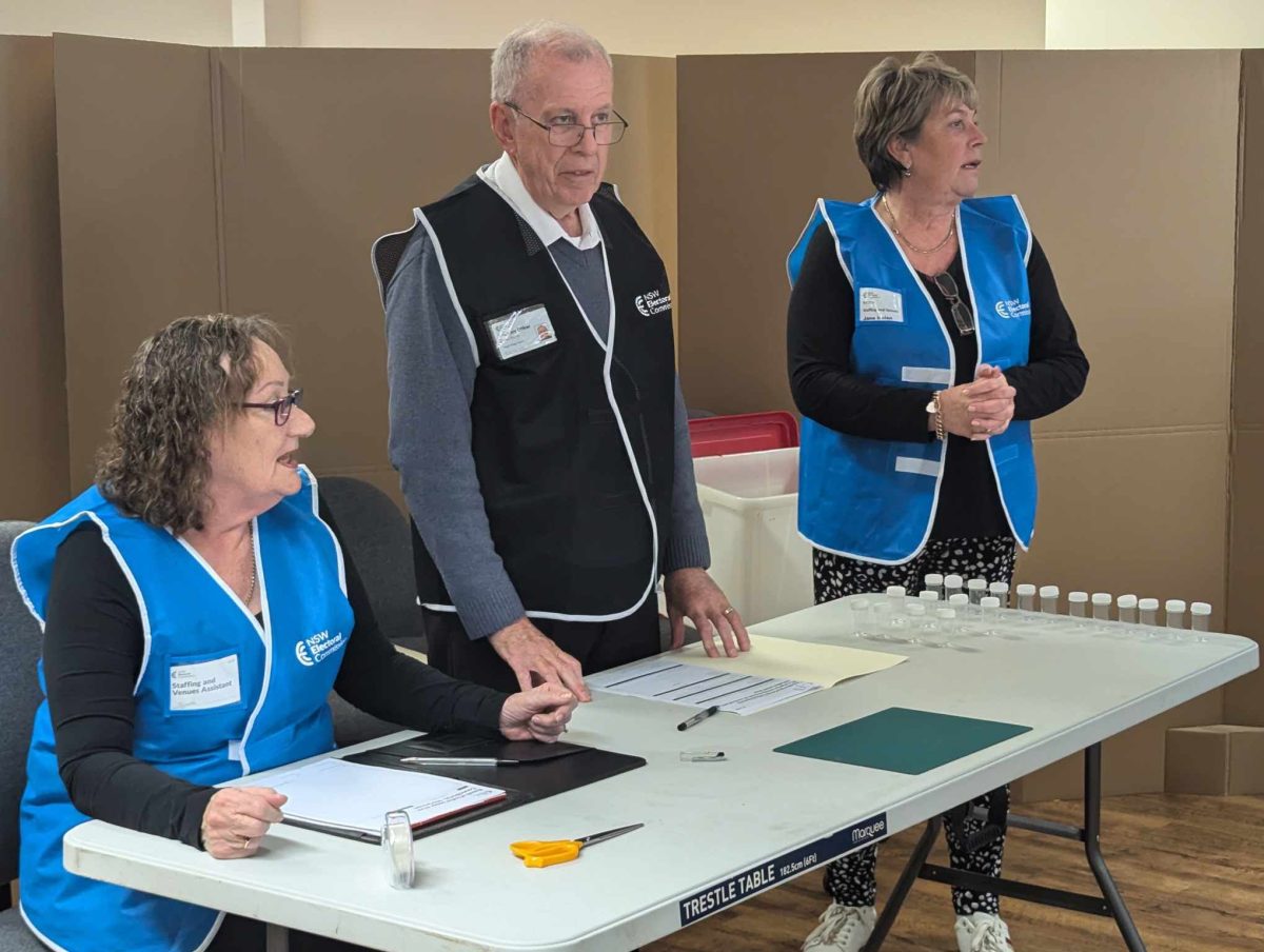 Returning officer (RO) Darrell Martin drawing tickets. 