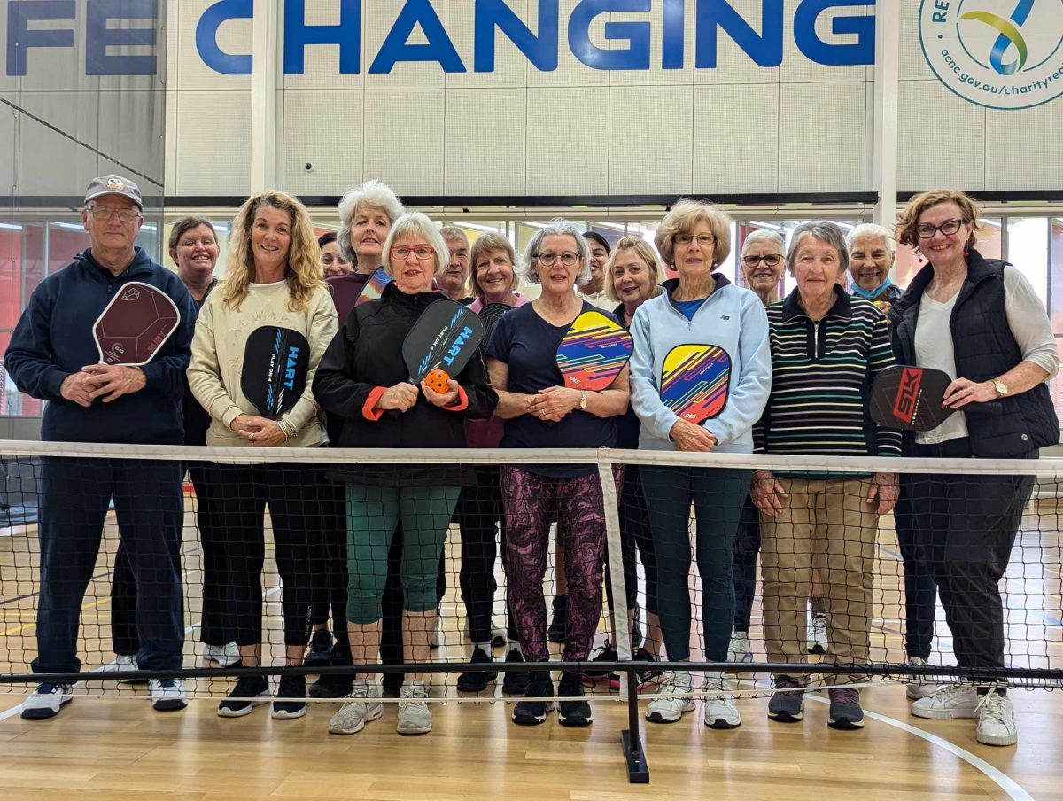 Wagga's pickleball club in front of a net