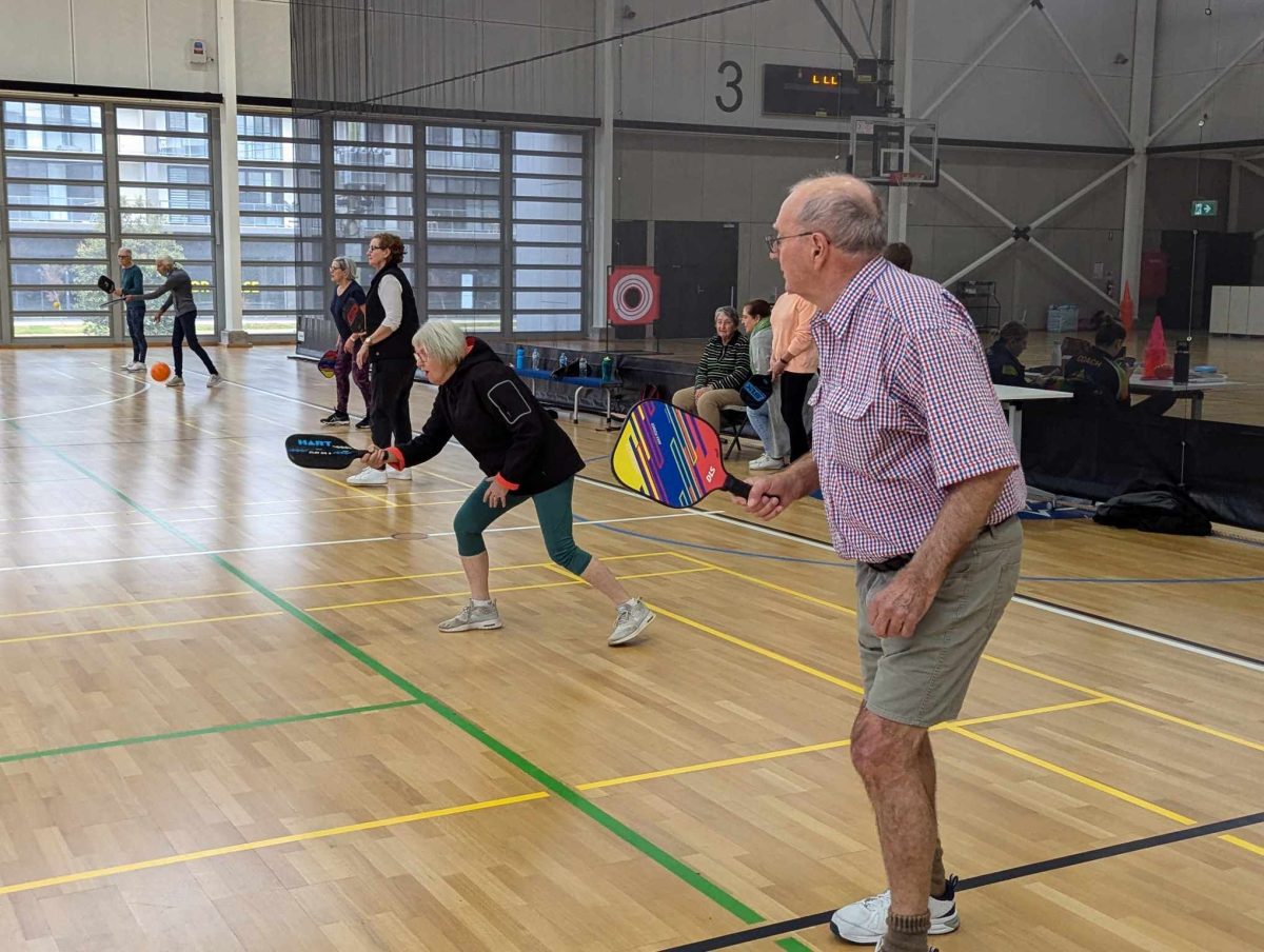 Players playing pickleball. 