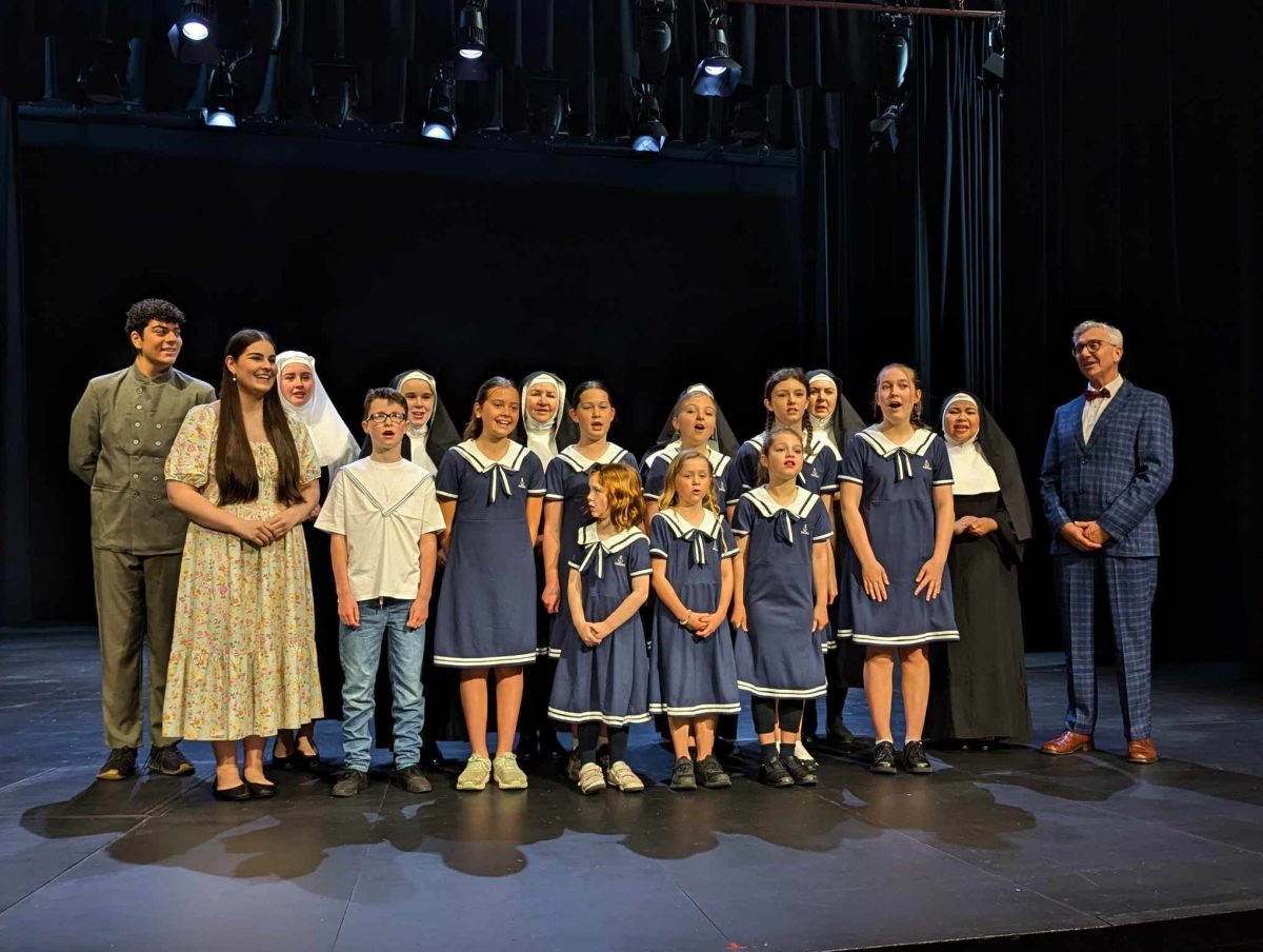 The cast of the sound of music on stage. 