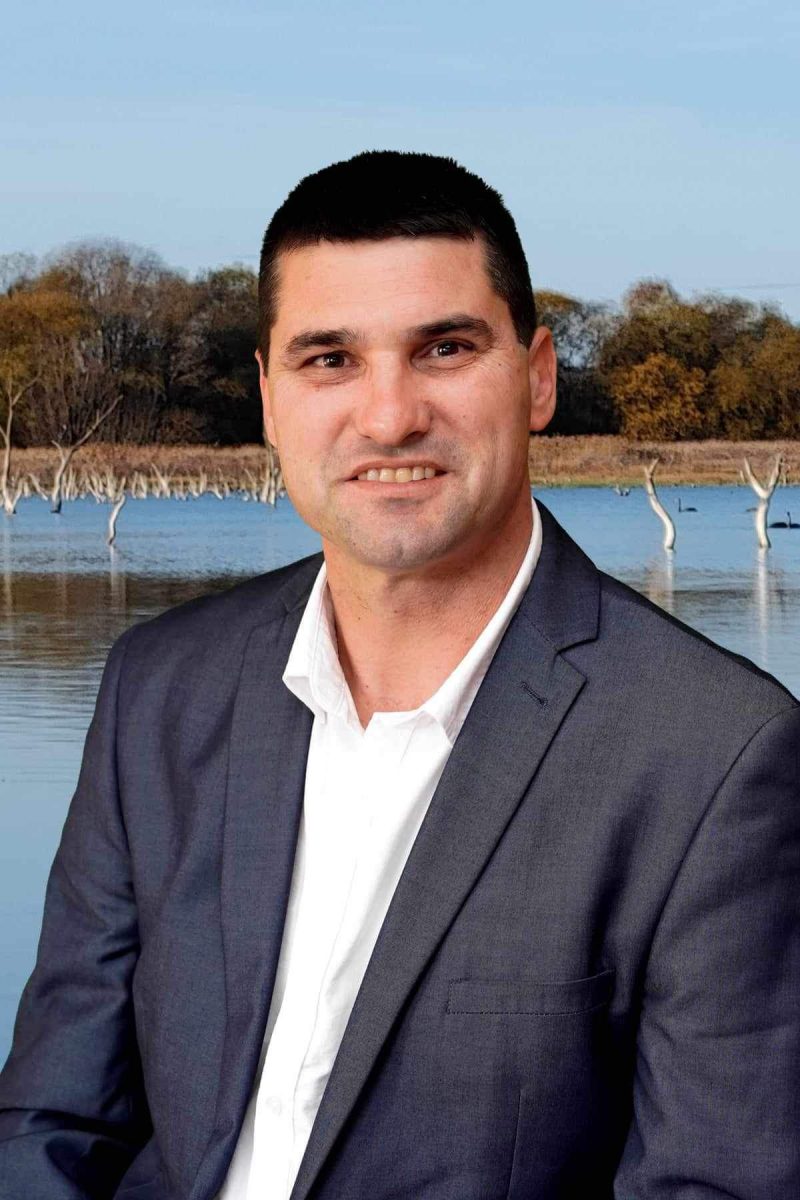 Tony O'Grady in front of lake 