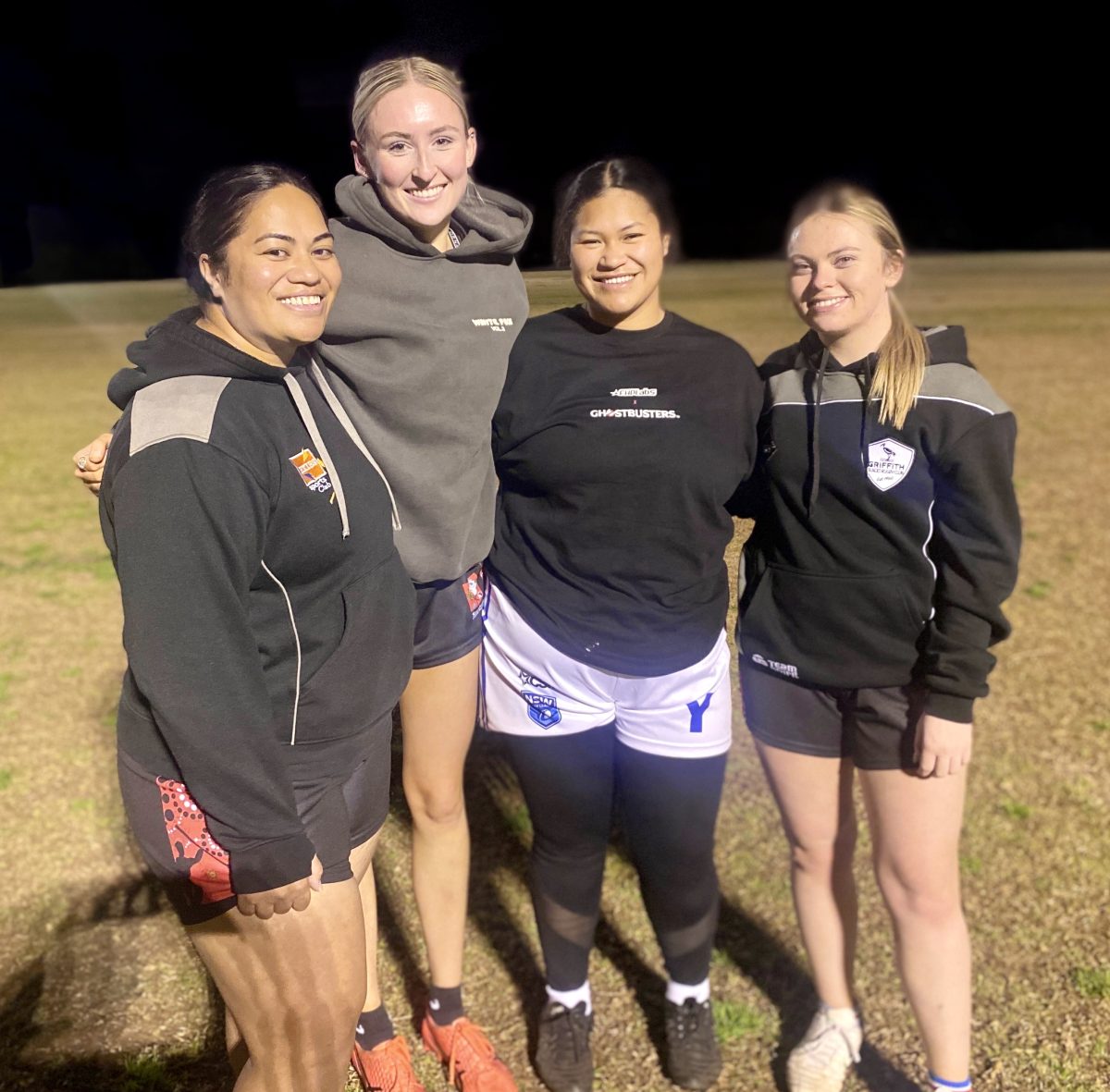 Four women's rugby players at training 