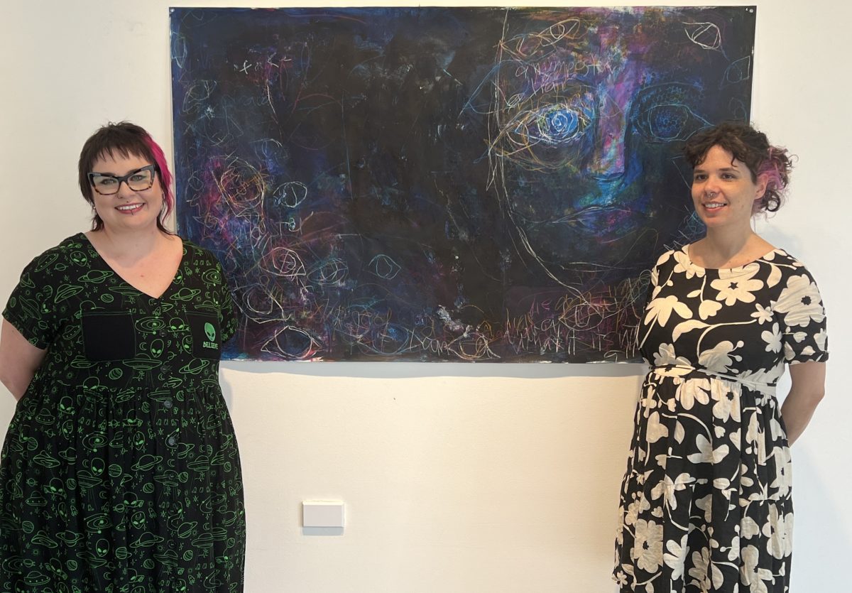 Tegan Bailey and Mary Egan with the artwork <em>Imposter</em>.