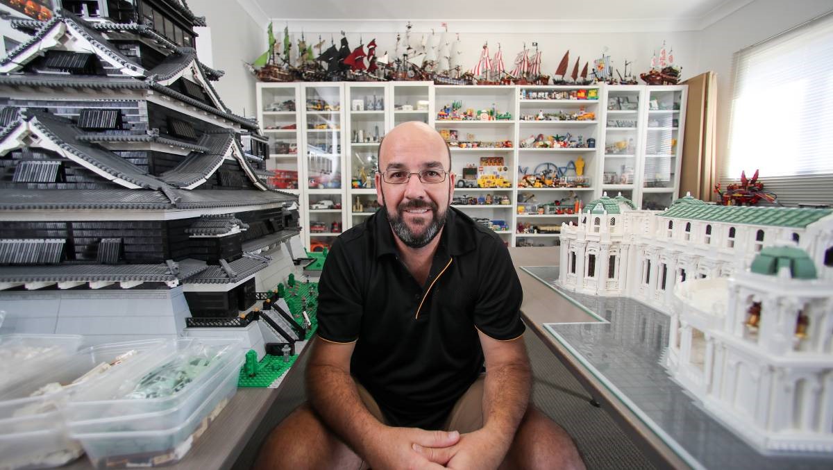 Man surrounded by Lego models