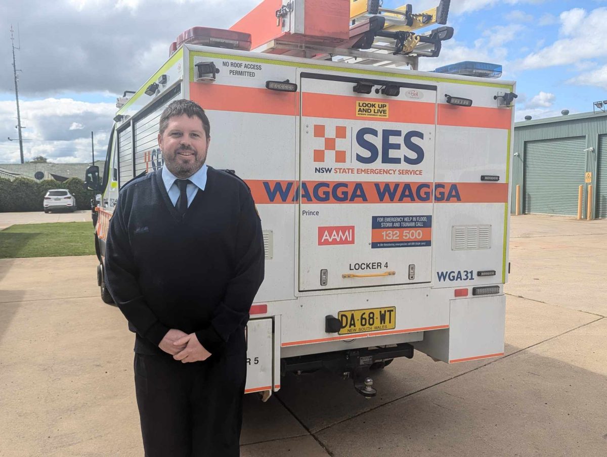 SES official in front of a service vehicle