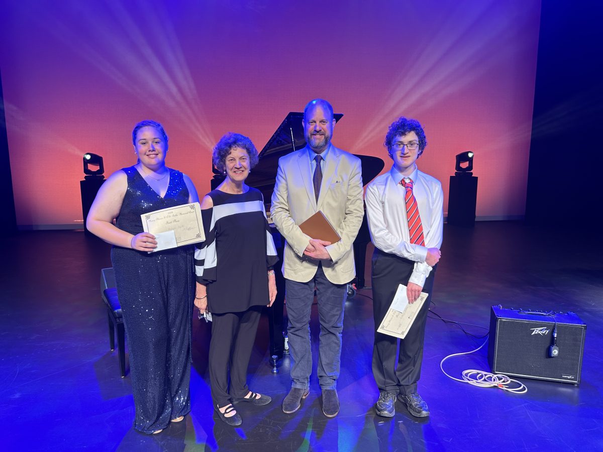 Row of award winners on stage 