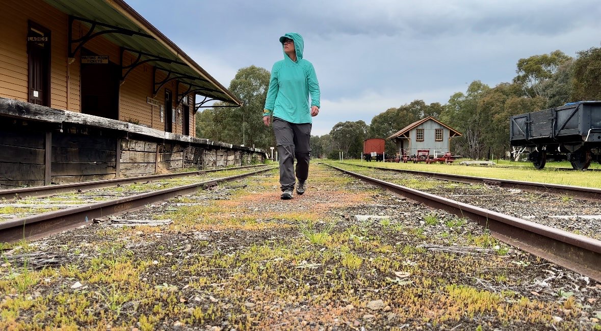 Leigh Swansborough walking along a disused rail line