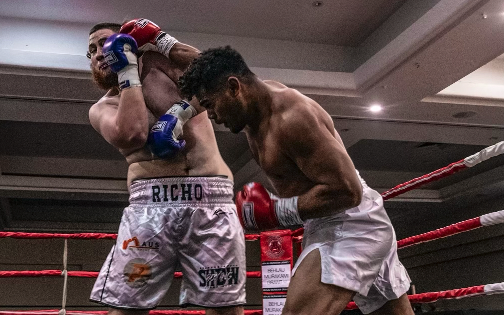 boxing match between two professional male fighters