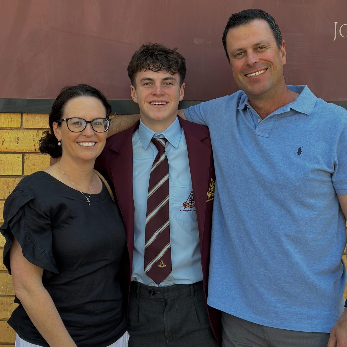 parents with student in uniform 