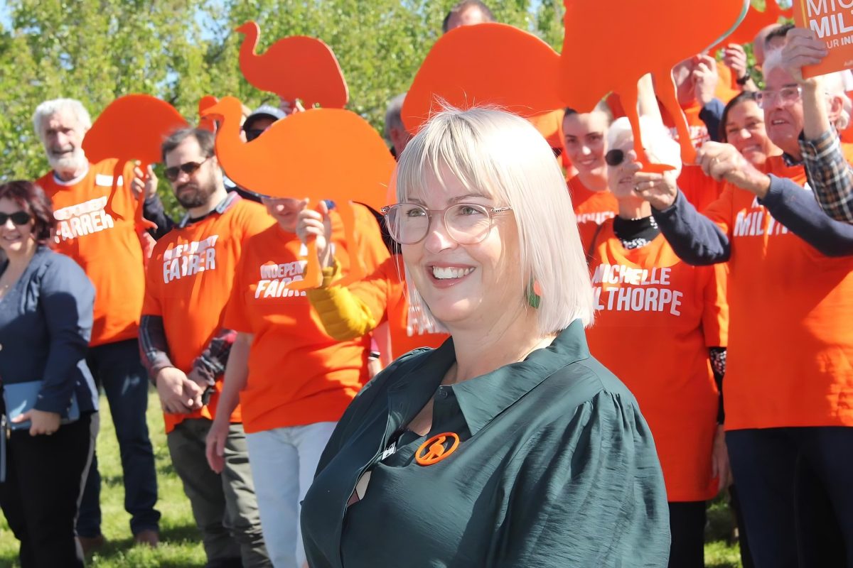 MIchelle Milthorpe in front of orange supporters