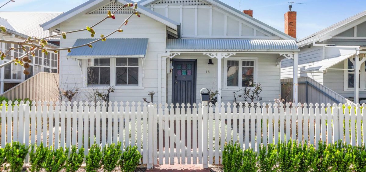 house with white picket fence