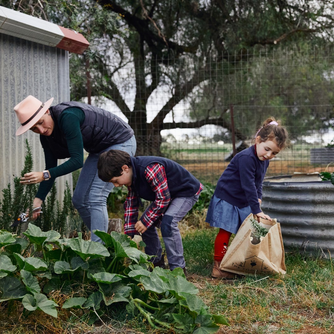 three people in the garden